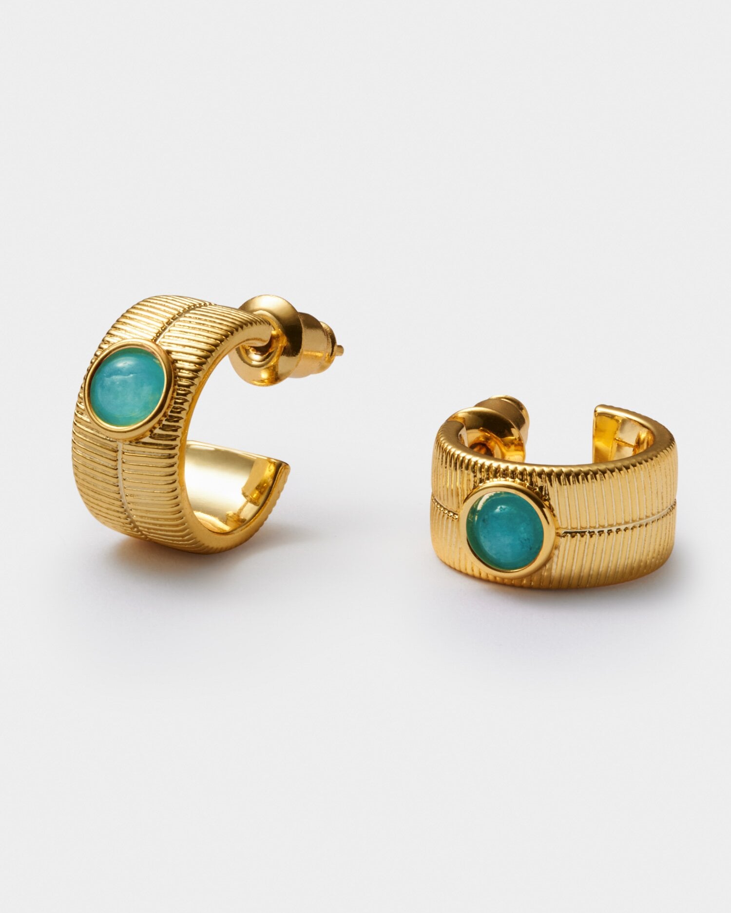 Gold hoop earrings with textured finish and central turquoise cabochon stone