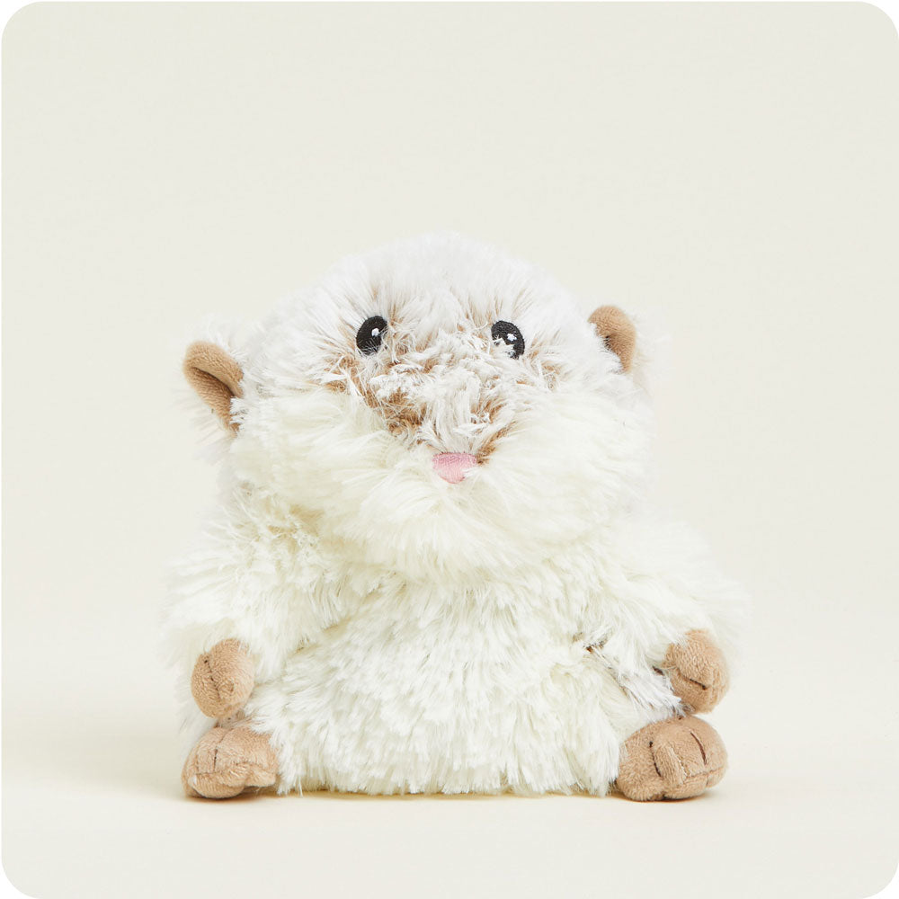 Small fluffy white hamster plush toy with tan ears and feet