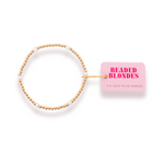 Gold beaded bracelet with a pink 'Beaded Blondes' box on a white background