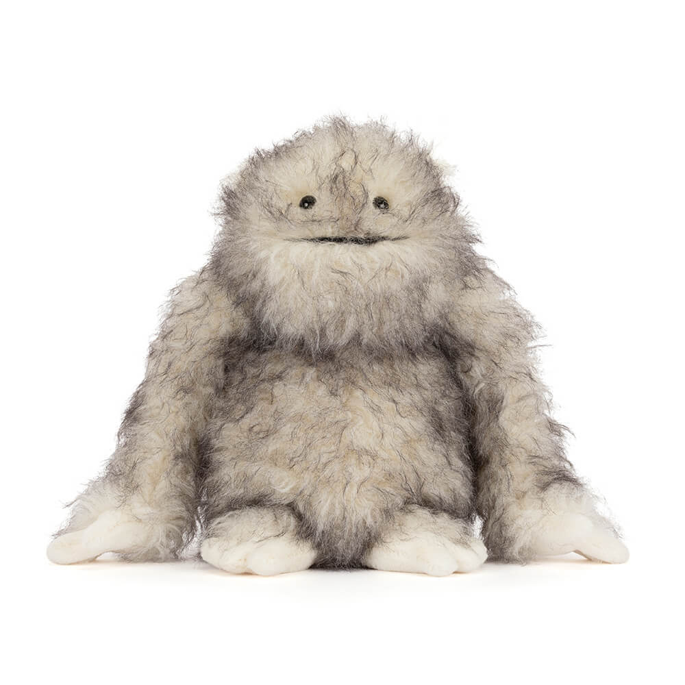 Shaggy grey and white plush yeti toy
