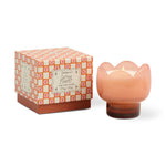 Tulip shaped candle with a decorative box on a white background