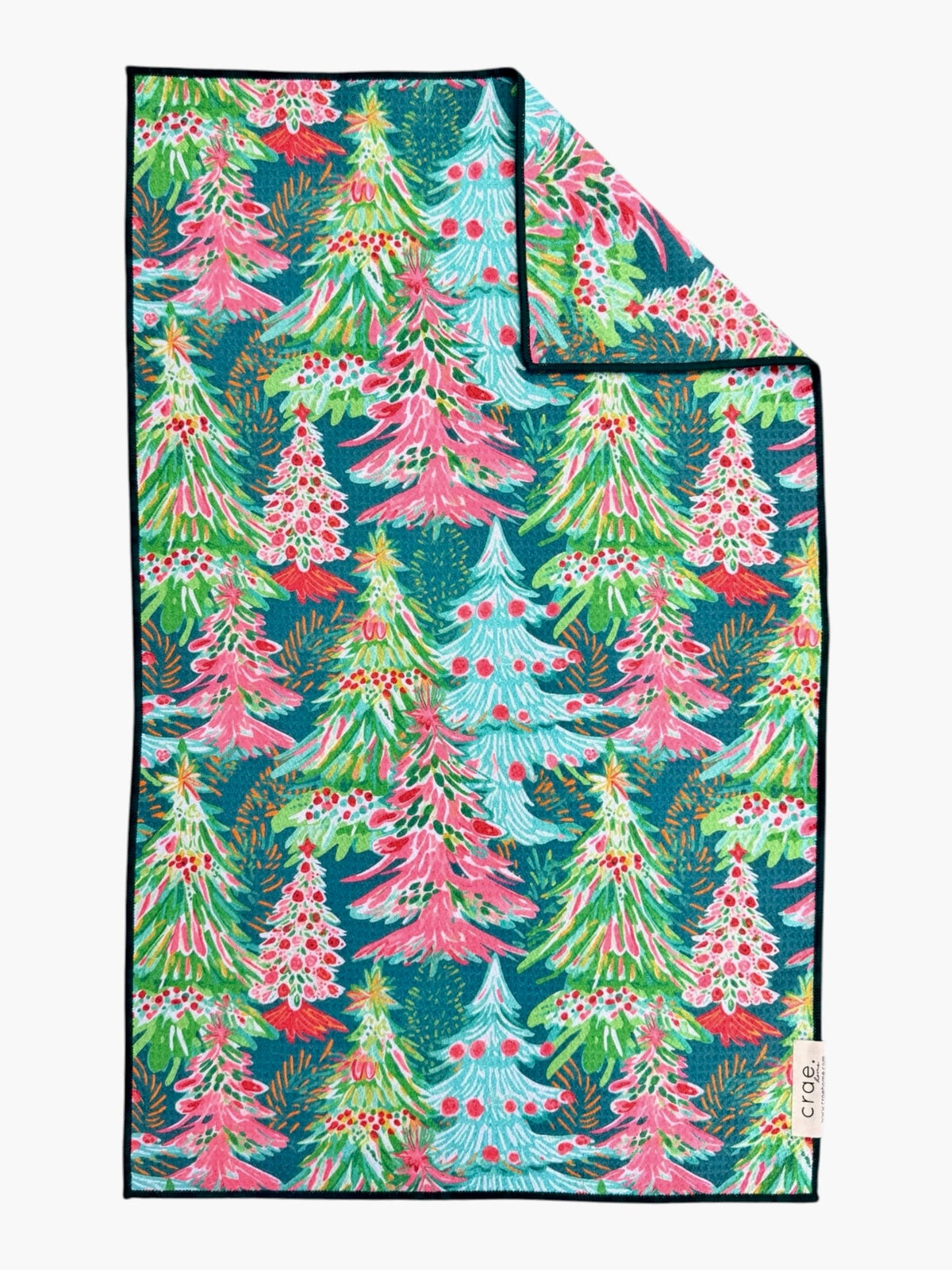 Teal hand towel printed with pink, green and aqua painted Christmas trees