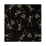 Black cocktail napkin with dancing skeletons and "bone appétit"