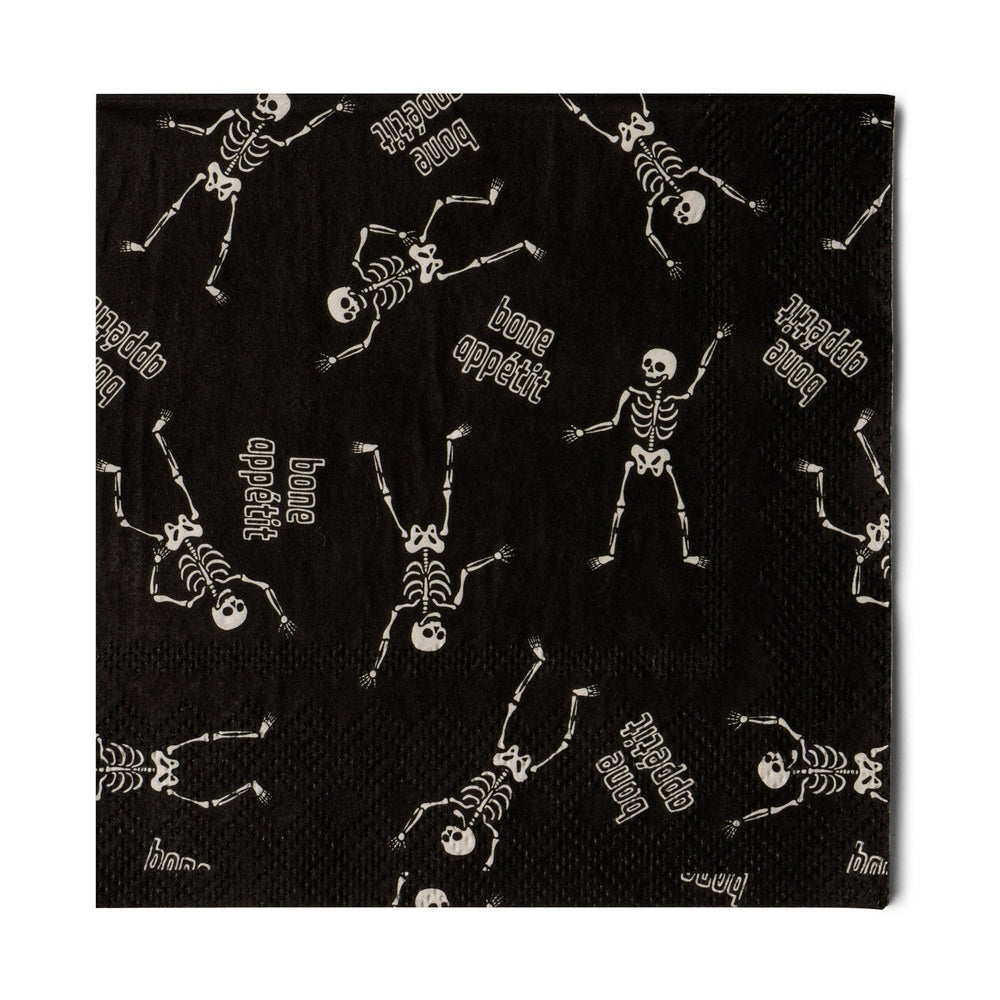 Black cocktail napkin with dancing skeletons and "bone appétit"