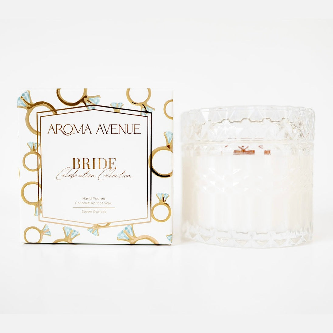 Aroma Avenue candle packaging with a white candle on a light gray background