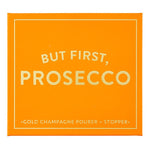 Orange book box reading But First, Prosecco