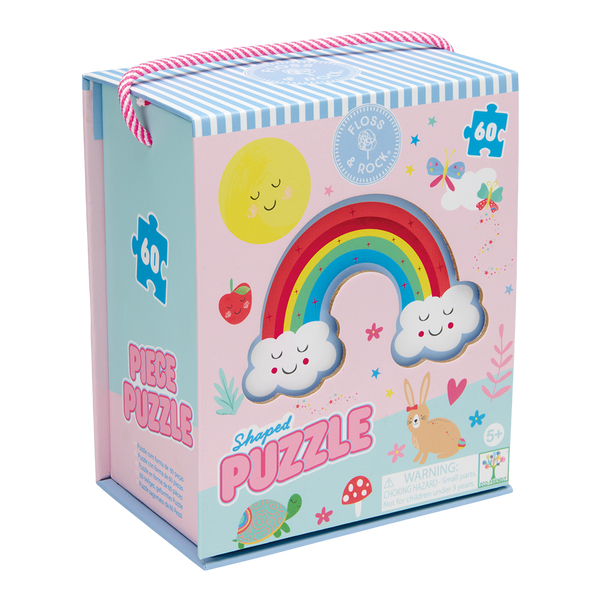Floss & Rock 60-piece shaped puzzle box featuring a vibrant rainbow with smiling clouds, a cheerful yellow sun, and a brown bunny with a red bow beside a colorful turtle