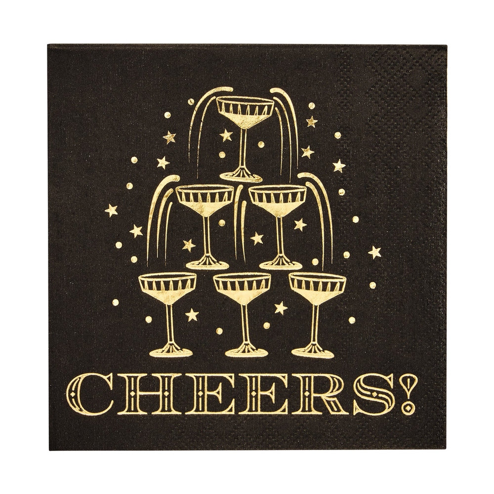 Black napkin with gold foil champagne tower graphic and the word Cheers