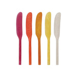 Five colorful knives in a row on a white background