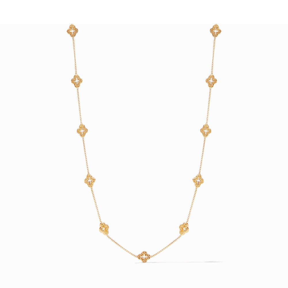 Gold chain necklace featuring nine evenly spaced clover shaped charms