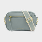 Gray crossbody bag with gold accents on a white background