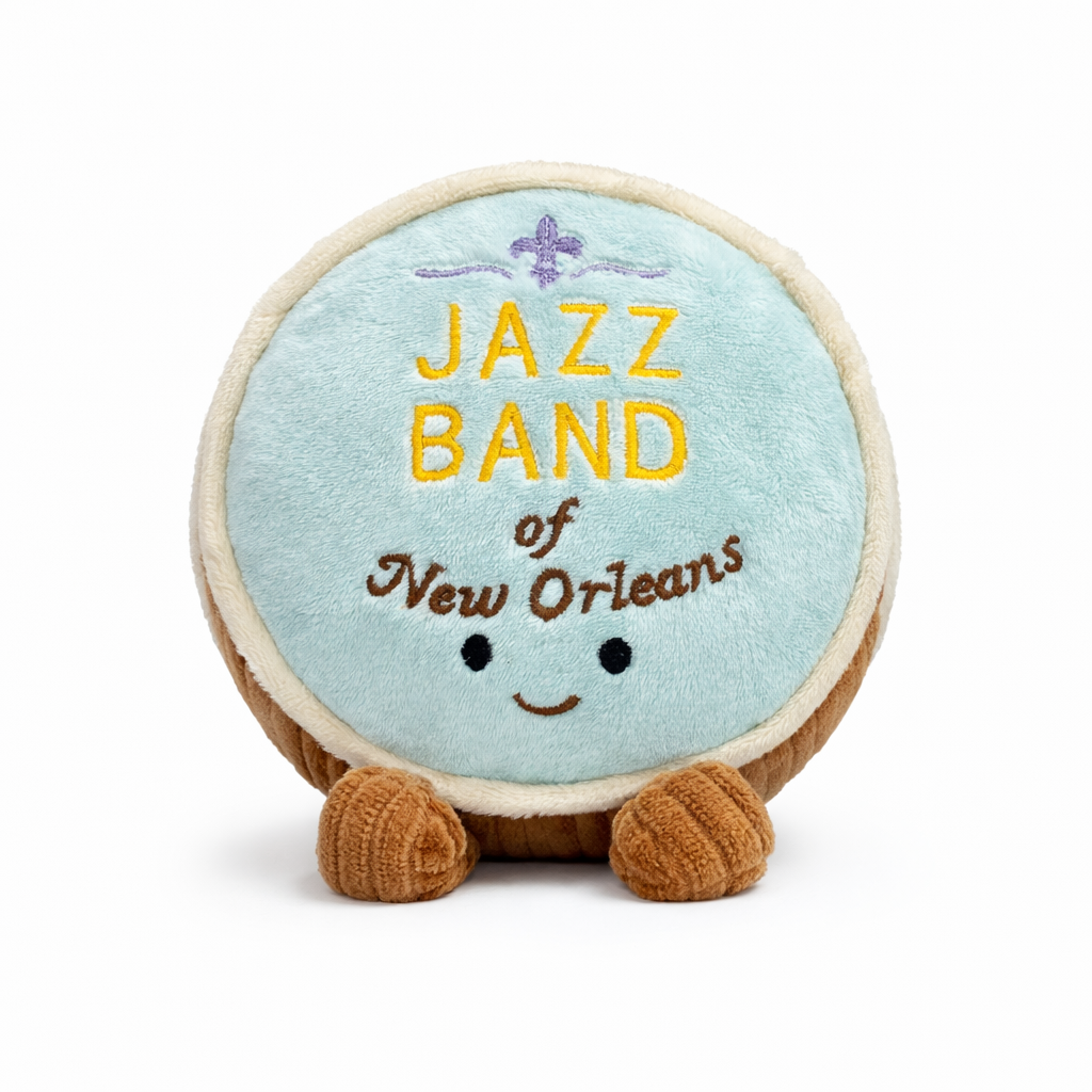 Plush toy shaped like a bass drum with 'Jazz Band of New Orleans' text on a white background