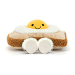 Plush fried egg on toast with a smiling yolk face and fluffy white feet