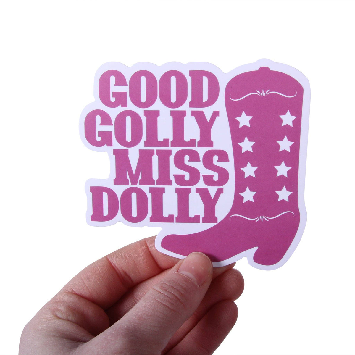 Hand holding a pink cowboy boot sticker reading Good Golly Miss Dolly