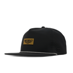 Black five panel snapback hat with perforated side panels and a tan branded patch on the front