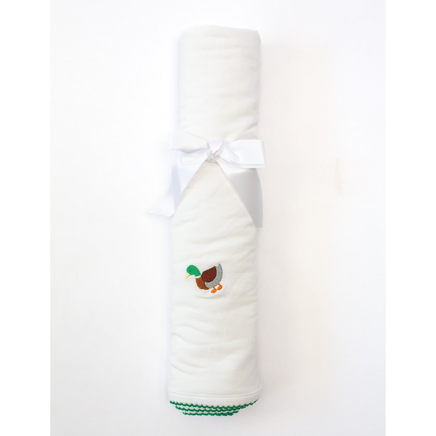 White towel with a duck design and green trim on a white background