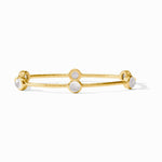Gold bangle bracelet featuring three round white gemstones