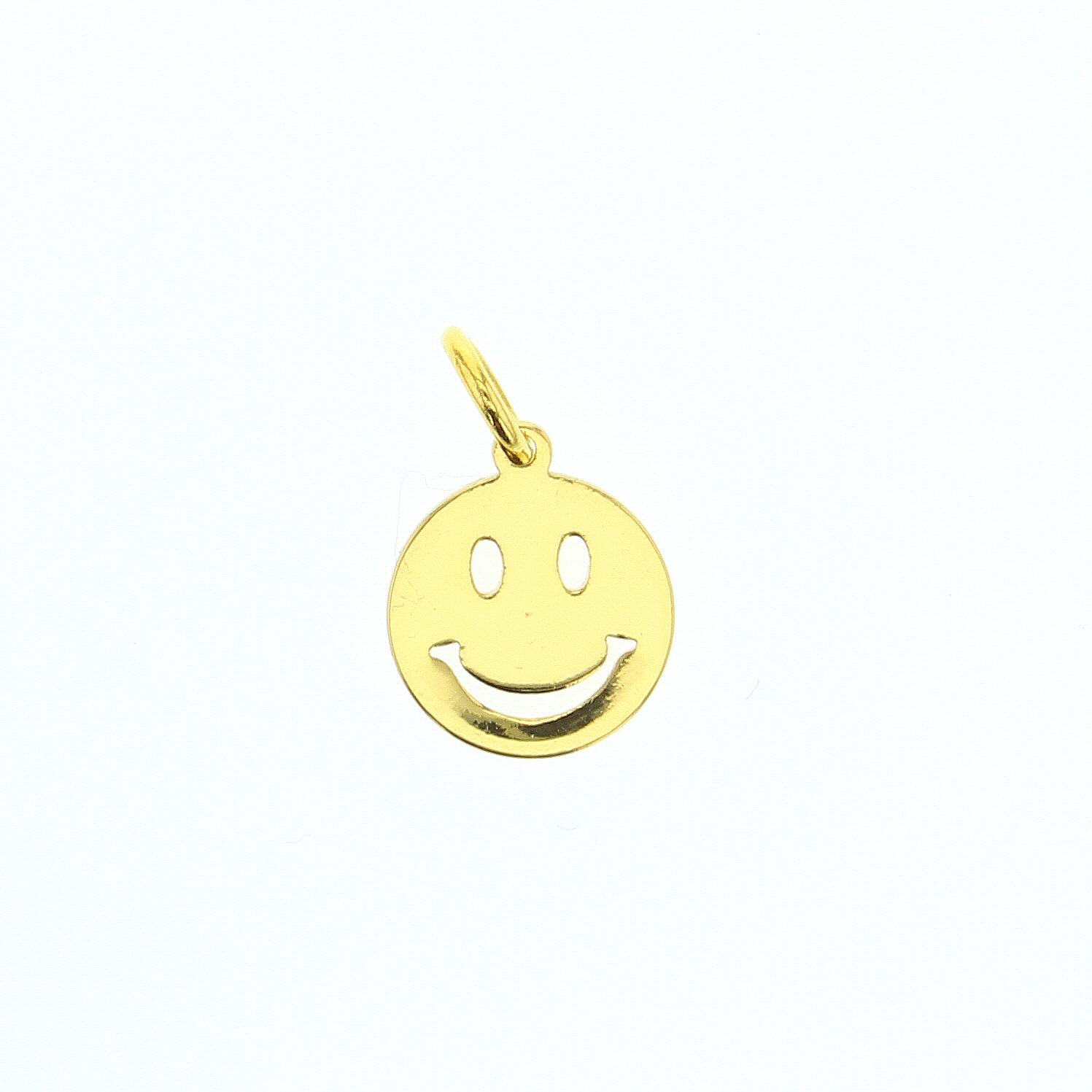 Gold smiley face pendant on a white background