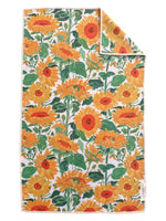 Rectangular kitchen towel with a repeating sunflower pattern on a white background