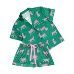 Green pajama set with pink animal pattern on a white background