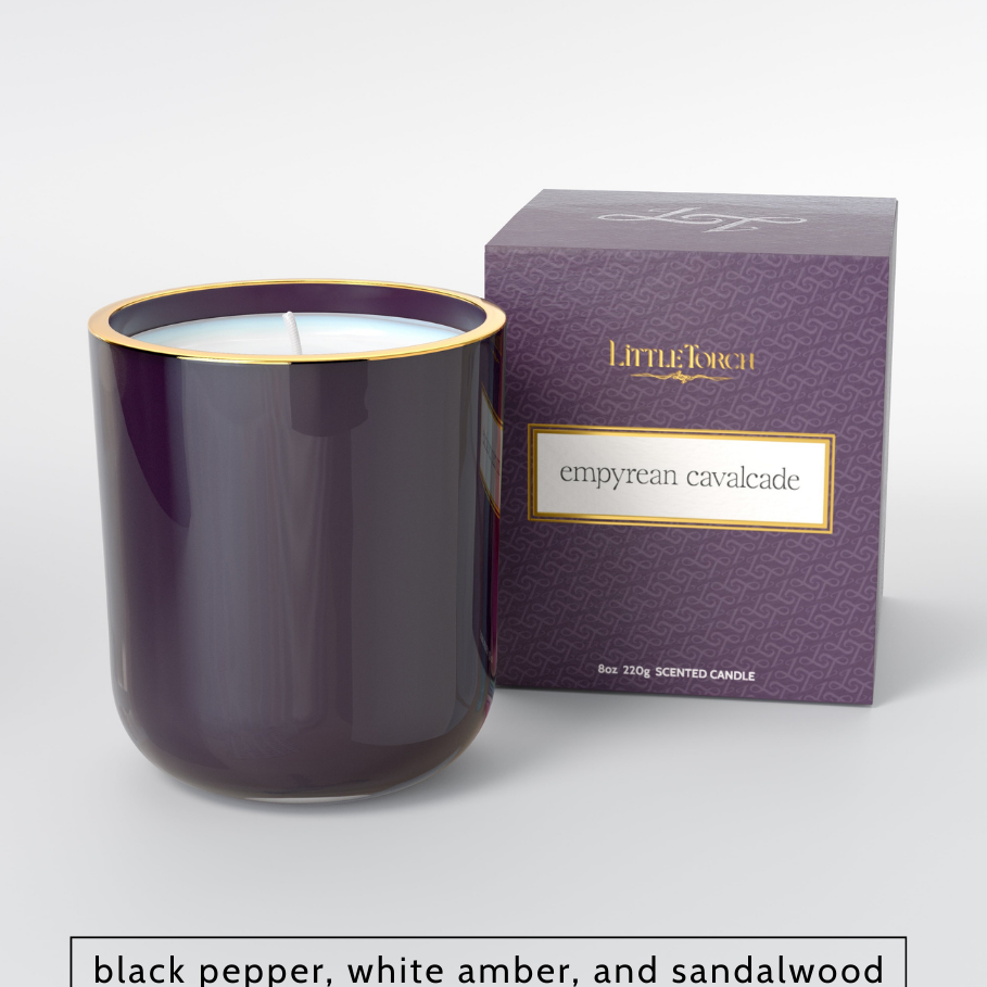Purple glass candle with gold rim and matching patterned box labeled Empyrean Cavalcade