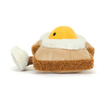 Side view of a plush fried egg on toast with fluffy white feet