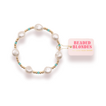 Pearl bracelet with gold and turquoise accents on a white background, featuring the 'Beaded Blondes' brand.