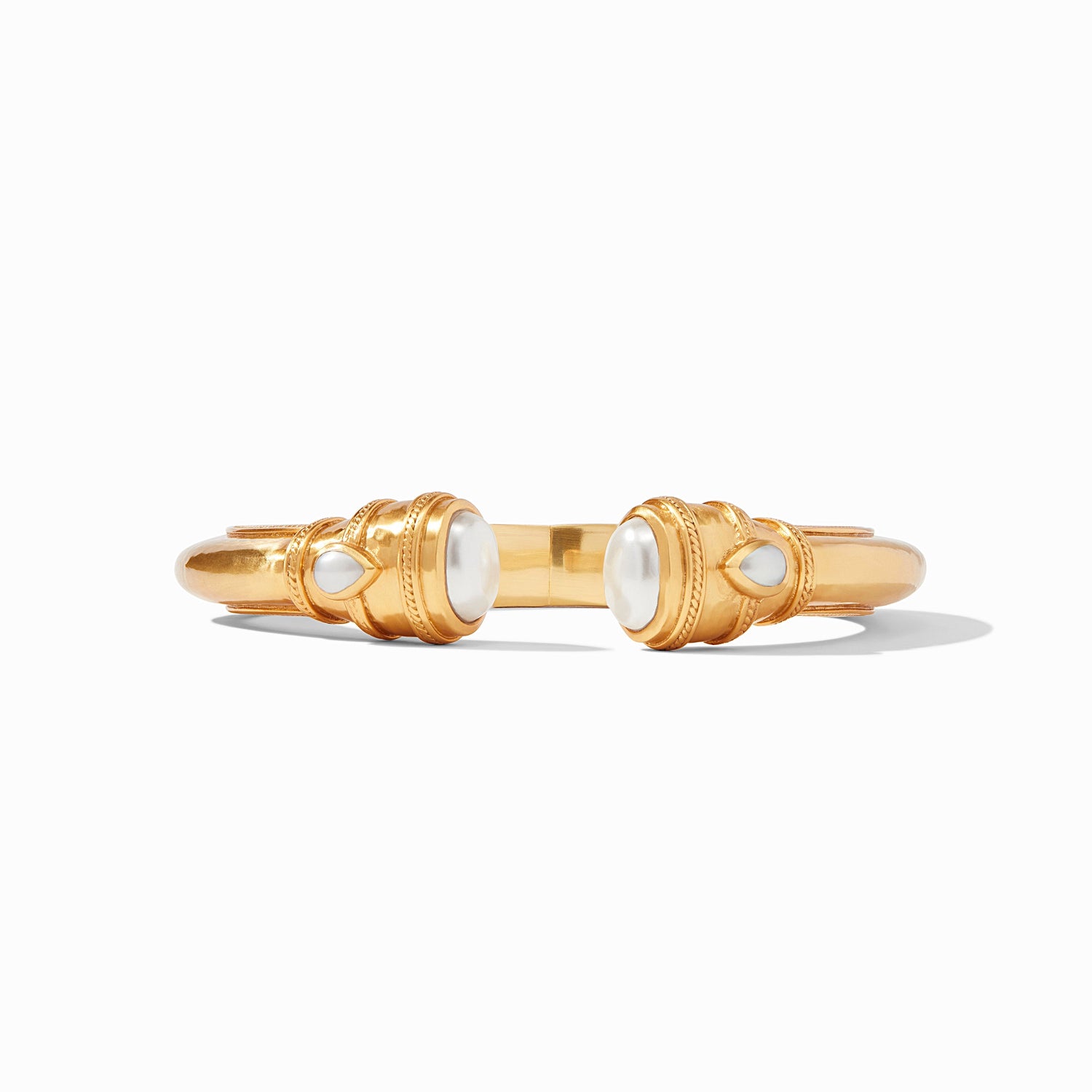 Gold cuff bracelet with pearl accents at both ends