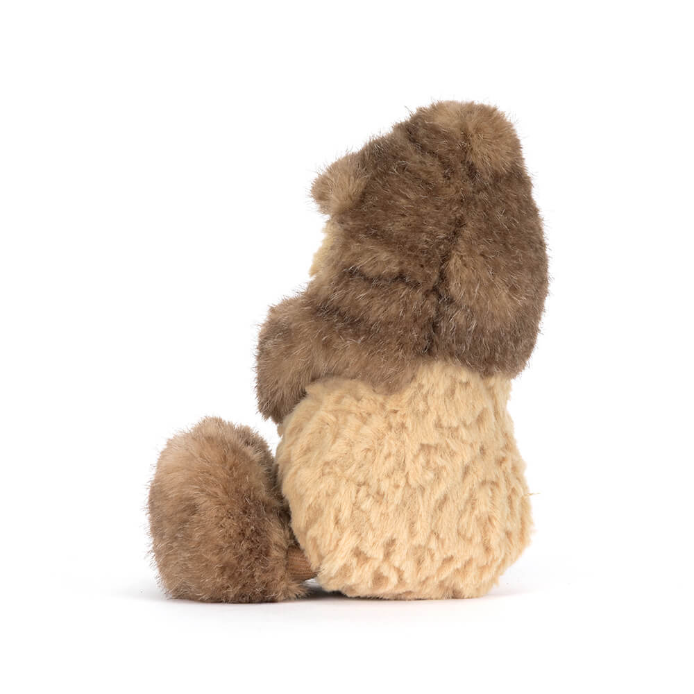 Side view of Plush toy peanut wearing a yeti costume on a white background