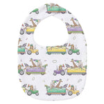 White baby bib with a print of giraffes, zebras and zoo animals riding purple, green and yellow parade floats