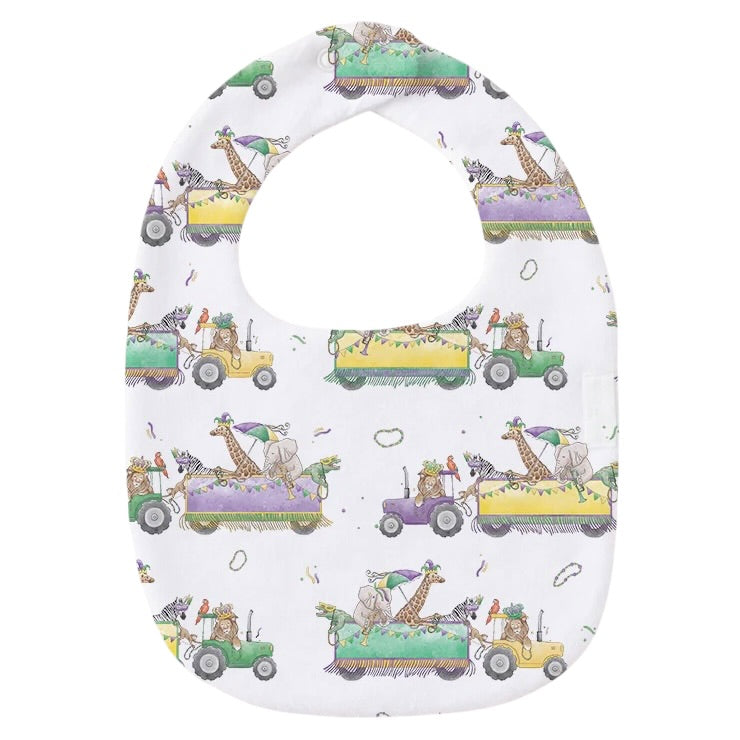 White baby bib with a print of giraffes, zebras and zoo animals riding purple, green and yellow parade floats