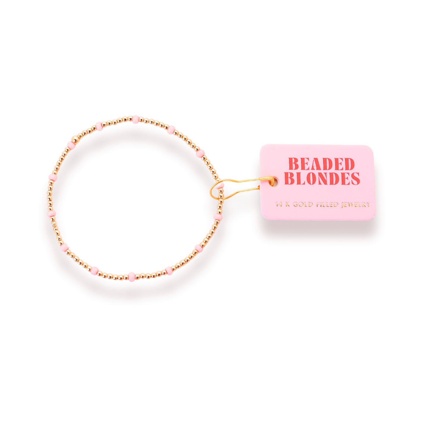 Beaded blonde hair tie with pink packaging on a white background