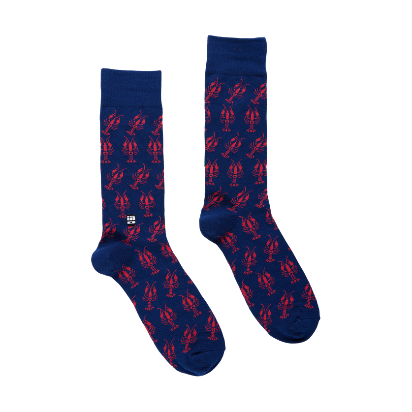 Pair of blue socks with red lobster pattern on a white background