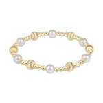 Stretch bracelet with gold beads and white pearls