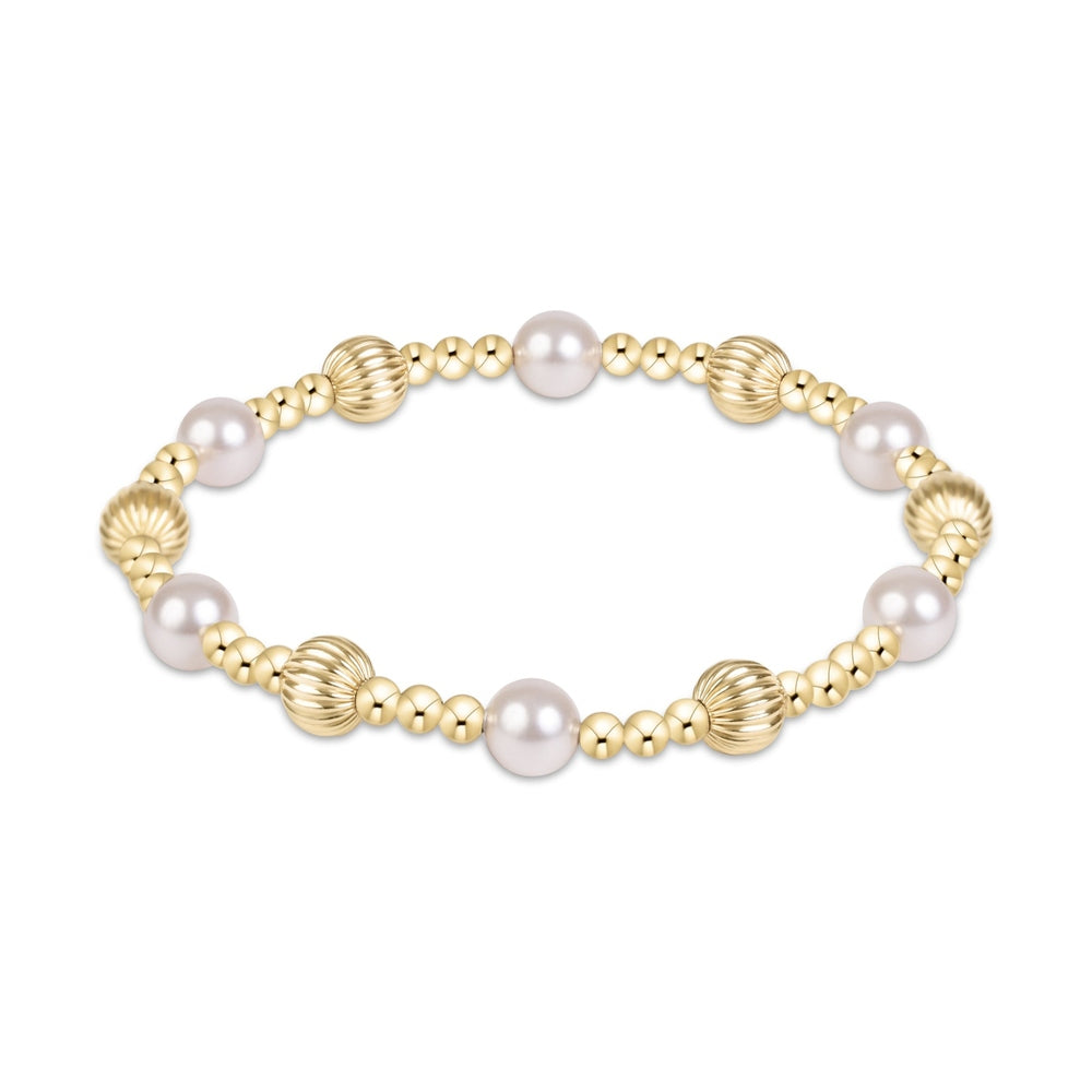 Stretch bracelet with gold beads and white pearls