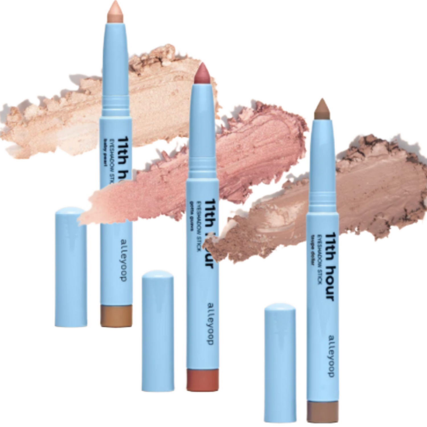 Three Alleyoop 11th Hour eyeshadow sticks in light blue tubes with matching swatches behind each