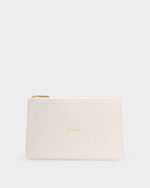 Studio photograph of a cream-colored saffiano leather bridal clutch centered on a neutral gray background featuring delicate gold cursive script reading Bride and a matching metallic zipper pull