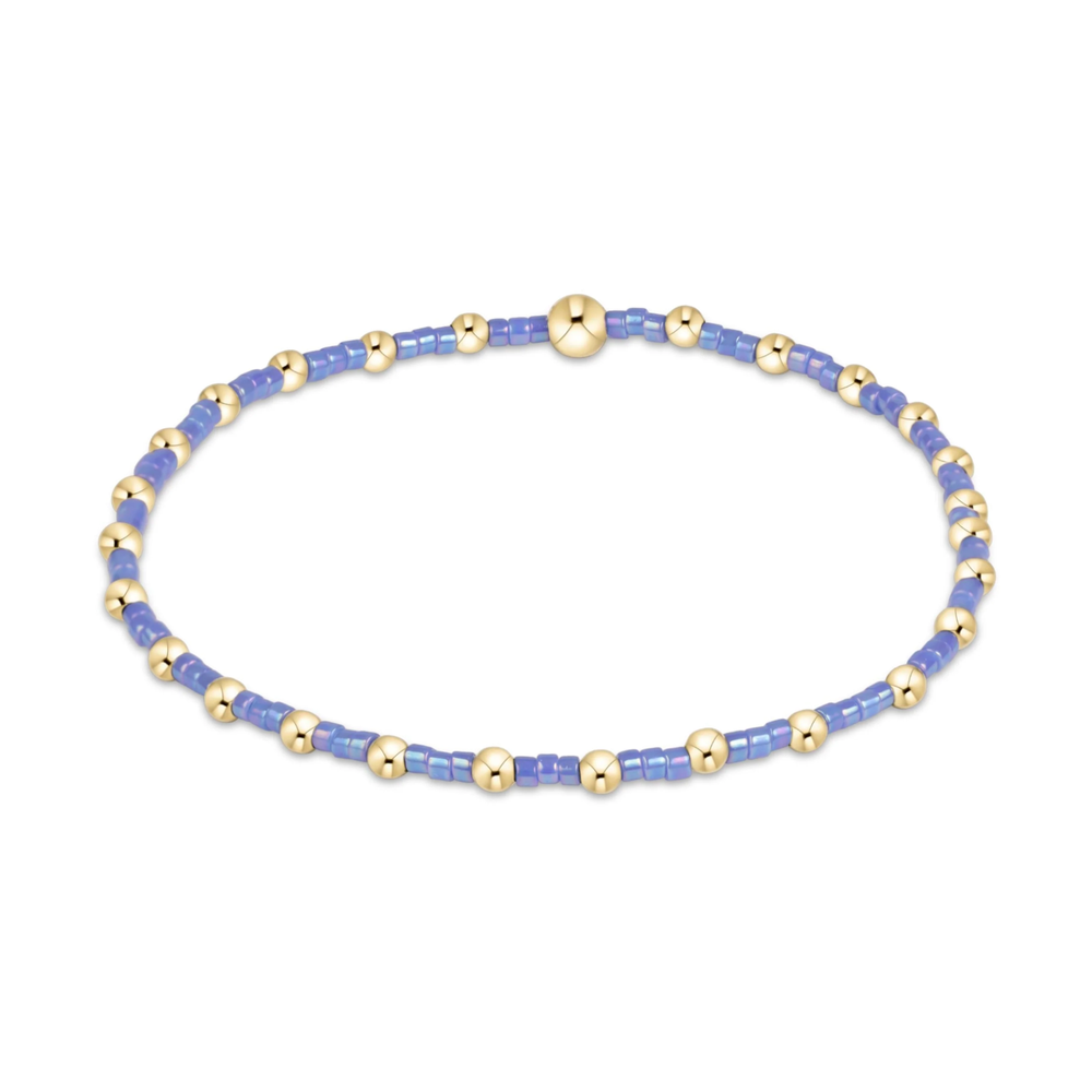 Periwinkle seed bead stretch bracelet with gold bead accents
