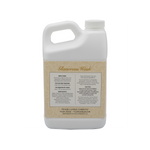 White plastic jug of Glamorous Wash laundry detergent with product label showing directions and ingredients