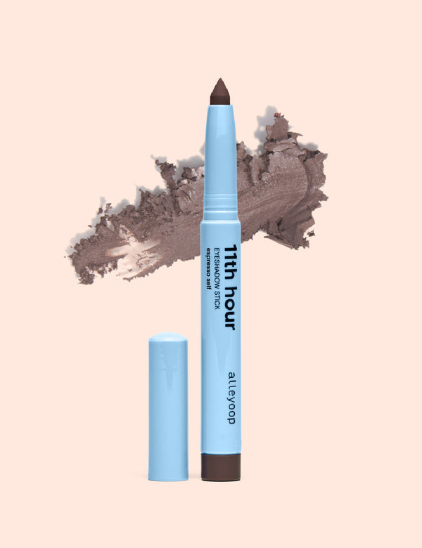 Alleyoop 11th hour eyeshadow stick in espresso self with cap removed and brown eyeshadow swatch