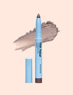 Charcolit eyeshadow stick with a matching charcoal eyeshadow swatch behind it
