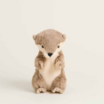 Plush otter toy with brown fur and cream belly