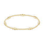 Gold beaded stretch bracelet with varying bead sizes