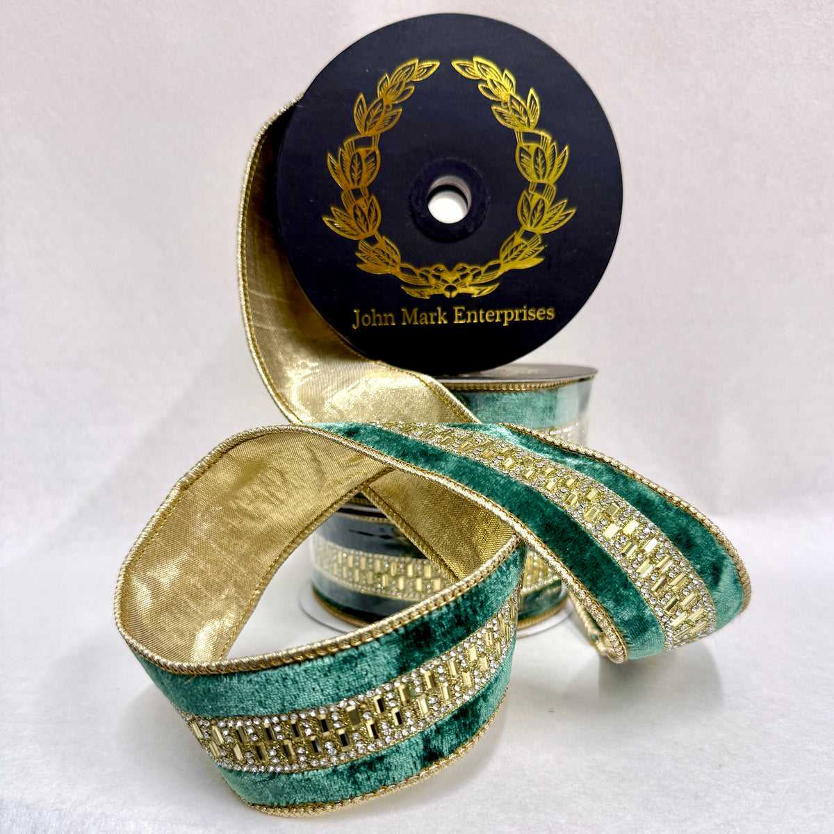 Spool of green velvet ribbon with a jeweled gold center trim