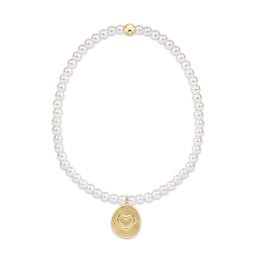 Pearl beaded necklace with a gold heart pendant