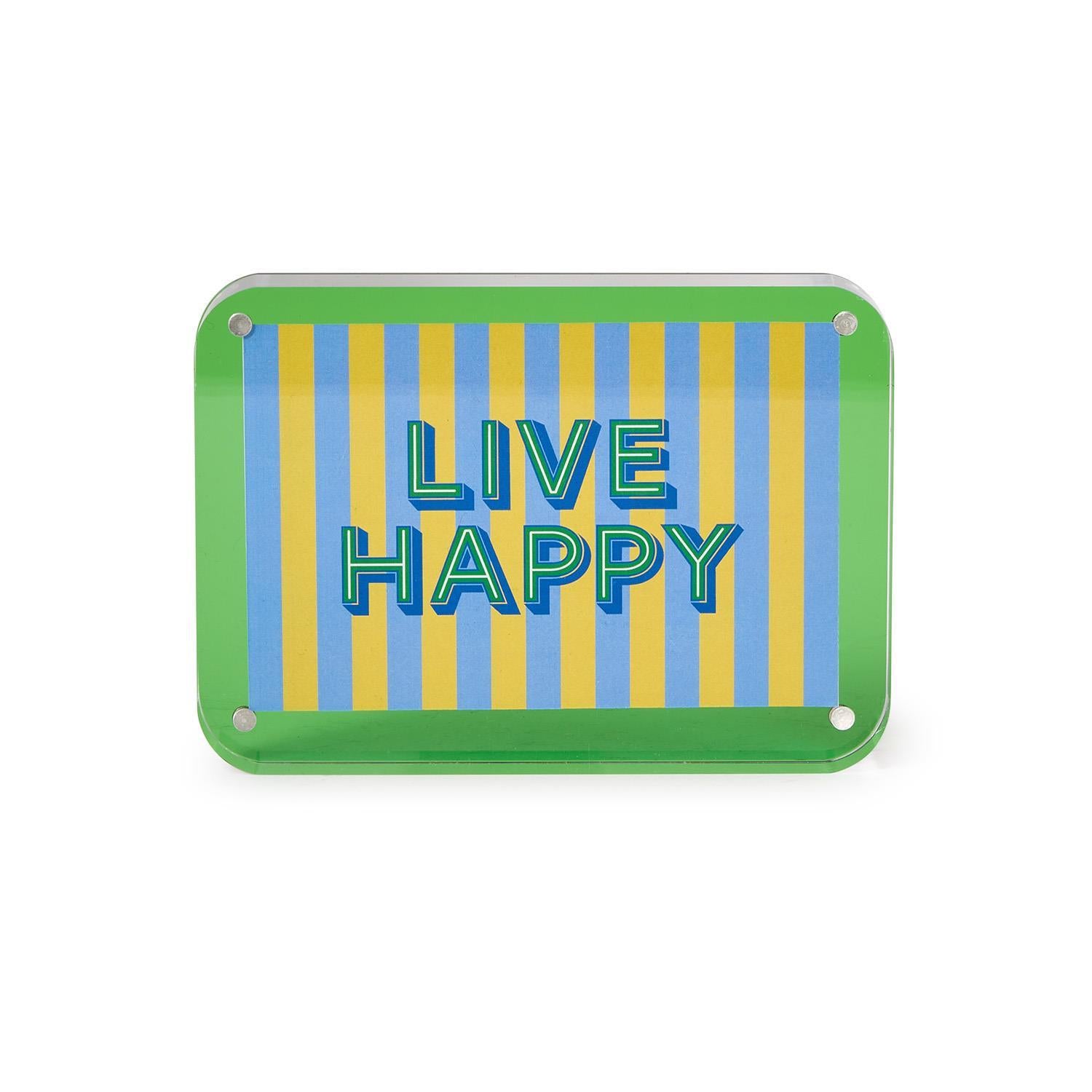 Acrylic sign featuring bold blue "LIVE HAPPY" text with a green outline over a background of vertical light blue and yellow stripes, all framed by a bright green border with silver corner screws