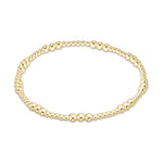 Gold beaded stretch bracelet with varying bead sizes
