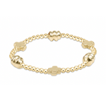 Gold beaded stretch bracelet with cross and ribbed bead accents