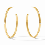 Gold hoop earrings with small white pearl accents