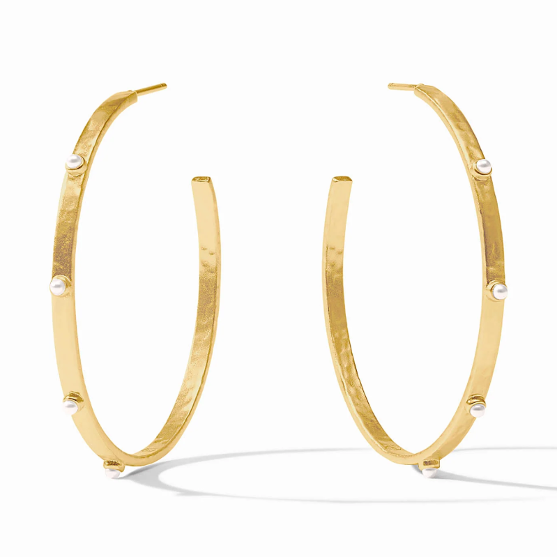 Gold hoop earrings with small white pearl accents